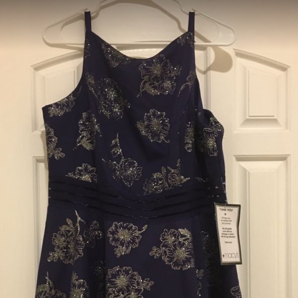 Purple cocktail dress with glittery flowers.